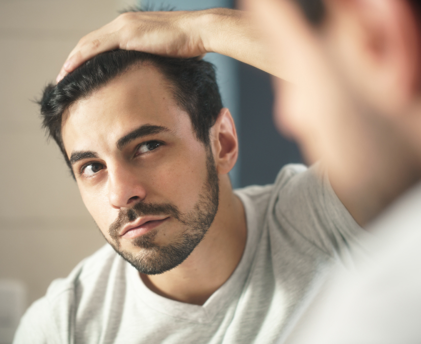 man looking at this hair